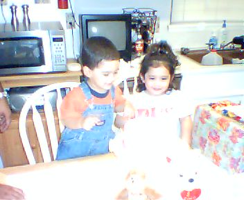 Tea & Jacob looking @ Tea's Birthday Cake